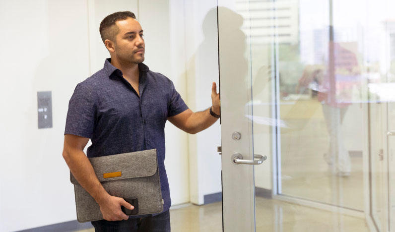 Male employee entering office